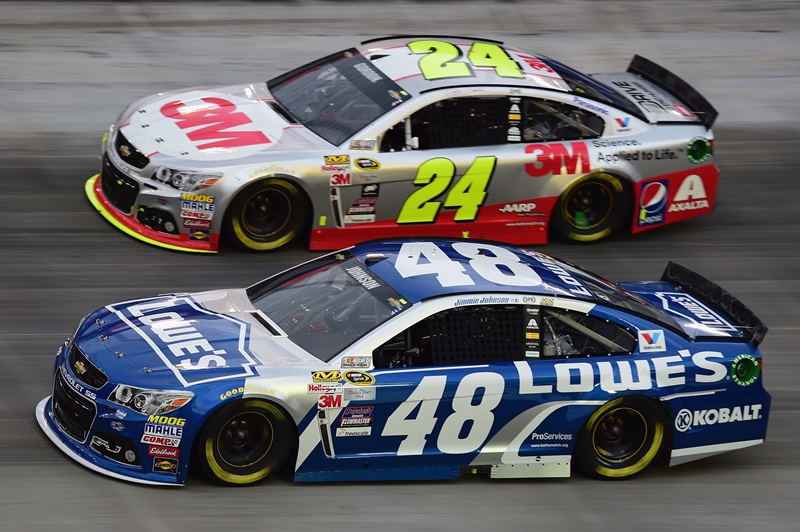 BRISTOL, TN - APRIL 19: Jeff Gordon, driver of the #24 3M Chevrolet, races Jimmie Johnson, driver of the #48 Lowe's Chevrolet, during the NASCAR Sprint Cup Series Food City 500 at Bristol Motor Speedway on April 19, 2015 in Bristol, Tennessee.  (Photo by Jared C. Tilton/Getty Images)