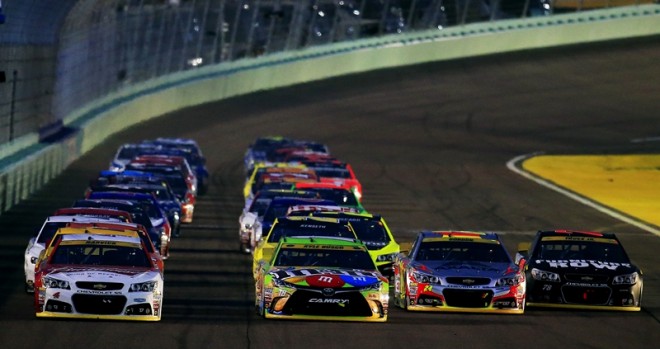 HOMESTEAD, FL - NOVEMBER 22:  Kevin Harvick, driver of the #4 Budweiser/Jimmy John's Chevrolet, Kyle Busch, driver of the #18 M&M's Crispy Toyota, Jeff Gordon, driver of the #24 AXALTA Chevrolet, and Martin Truex Jr., driver of the #78 Furniture Row/Denver Mattress Chevrolet, lead the field during a restart during the NASCAR Sprint Cup Series Ford EcoBoost 400 at Homestead-Miami Speedway on November 22, 2015 in Homestead, Florida.  (Photo by Chris Trotman/NASCAR via Getty Images)