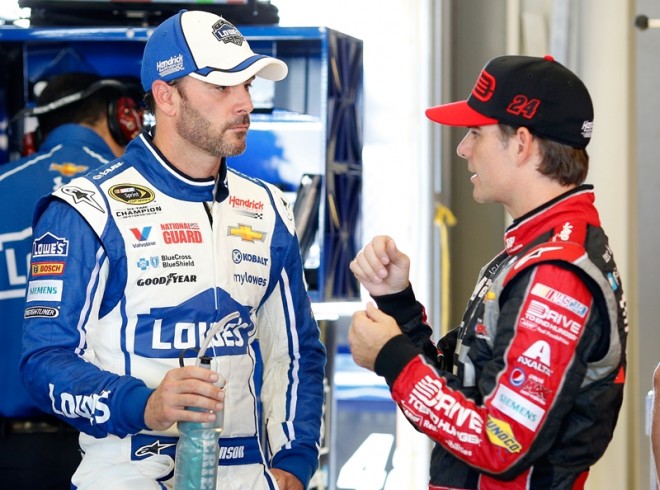 SPARTA, KY - JUNE 27:  Jimmie Johnson, driver of the #48 Lowe's Chevrolet, left, talks with Jeff Gordon, driver of the #24 Drive to End Hunger Chevrolet, in the garage area during practice for the NASCAR Sprint Cup Series Quaker State 400 presented by Advance Auto Parts at Kentucky Speedway on June 27, 2014 in Sparta, Kentucky.  (Photo by Joe Robbins/Getty Images)