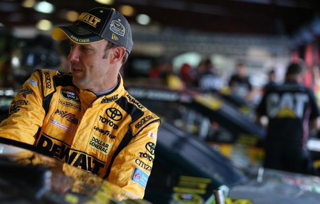 TALLADEGA, AL - OCTOBER 23: Matt Kenseth, driver of the #20 DeWalt Toyota, stands in the garage area during practice for the NASCAR Sprint Cup Series CampingWorld.com 500 at Talladega Superspeedway on October 23, 2015 in Talladega, Alabama.  (Photo by Patrick Smith/Getty Images)