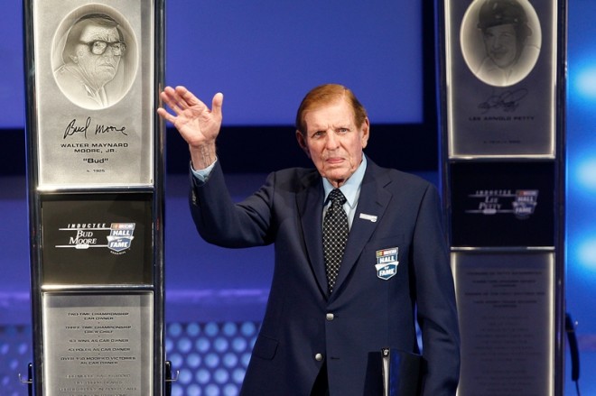 CHARLOTTE, NC - MAY 23:  Class of 2011 Inductee Bud Moore waves to the audience on stage during the 2011 NASCAR Hall of Fame induction ceremonies at the Charlotte Convention Center on May 23, 2011 in Charlotte, North Carolina.  (Photo by John Harrelson/Getty Images for NASCAR)