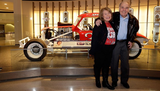 CHARLOTTE, NC - JANUARY 21: NASCAR Hall of Fame inductee Jerry Cook, right, poses for photographs with his wife, Sue during a private viewing of his display in the Hall of Honor with close family members, January 22, 2016, a day before the induction ceremonies in Charlotte, North Carolina. (Photo by Bob Leverone/NASCAR via Getty Images)