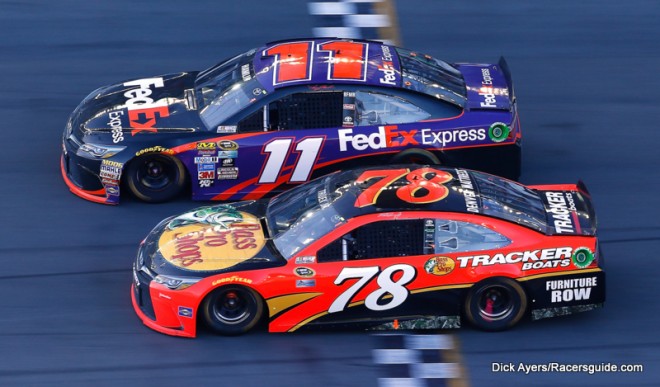 DAYTONA BEACH, FL - FEBRUARY 21: Denny Hamlin, driver of the #11 FedEx Express Toyota, takes the checkered flag ahead of Martin Truex Jr., driver of the #78 Bass Pro Shops/Tracker Boats Toyota, to win the NASCAR Sprint Cup Series DAYTONA 500 at Daytona International Speedway on February 21, 2016 in Daytona Beach, Florida. (Photo by Jonathan Ferrey/Getty Images)
