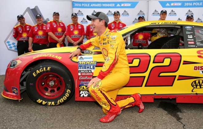 MARTINSVILLE, VA - APRIL 01: Joey Logano, driver of the #22 Shell Pennzoil Ford, poses with the Coors Light Pole Award after qualifying for pole position for the NASCAR Sprint Cup Series STP 500 at Martinsville Speedway on April 1, 2016 in Martinsville, Virginia. (Photo by Sean Gardner/NASCAR via Getty Images)