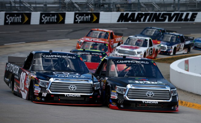 MARTINSVILLE, VA - APRIL 02: Ben Rhodes, driver of the #41 Alpha Energy Solutions Toyota, and Kyle Busch, driver of the #18 Toyota Toyota, leads a pack of cars during the NASCAR Camping World Truck Series Alpha Energy Solutions 250 at Martinsville Speedway on April 2, 2016 in Martinsville, Virginia. (Photo by Brian Lawdermilk/Getty Images)
