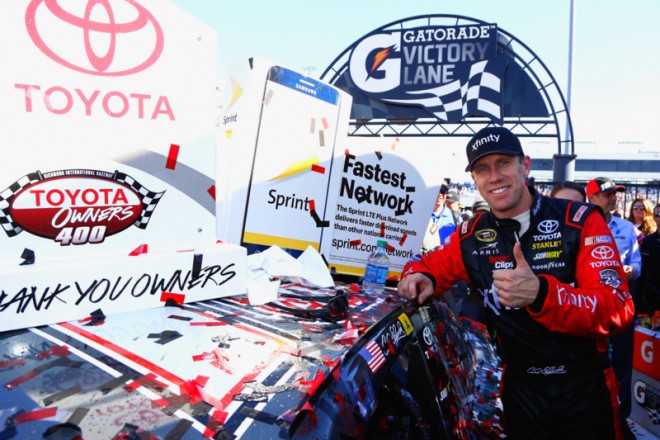 RICHMOND, VA - APRIL 24:  Carl Edwards, driver of the #19 XFINITY Toyota, poses with the winner's decal after winning the NASCAR Sprint Cup Series TOYOTA OWNERS 400 at Richmond International Raceway on April 24, 2016 in Richmond, Virginia.  (Photo by Daniel Shirey/NASCAR via Getty Images)