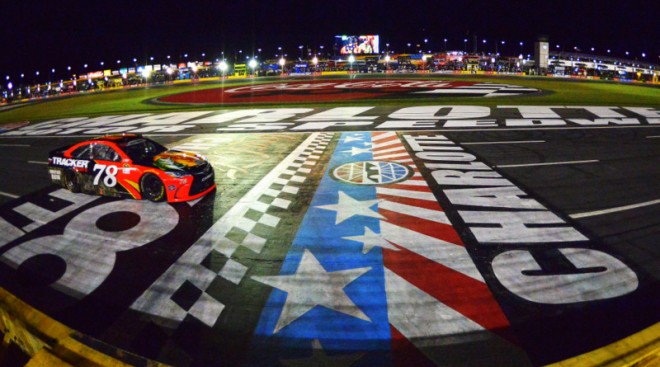 CHARLOTTE, NC - MAY 29: Martin Truex Jr., driver of the #78 Bass Pro Shops/Tracker Toyota, takes the checkered flag during the NASCAR Sprint Cup Series Coca-Cola 600 at Charlotte Motor Speedway on May 29, 2016 in Charlotte, North Carolina. (Photo by Drew Hallowell/Getty Images)
