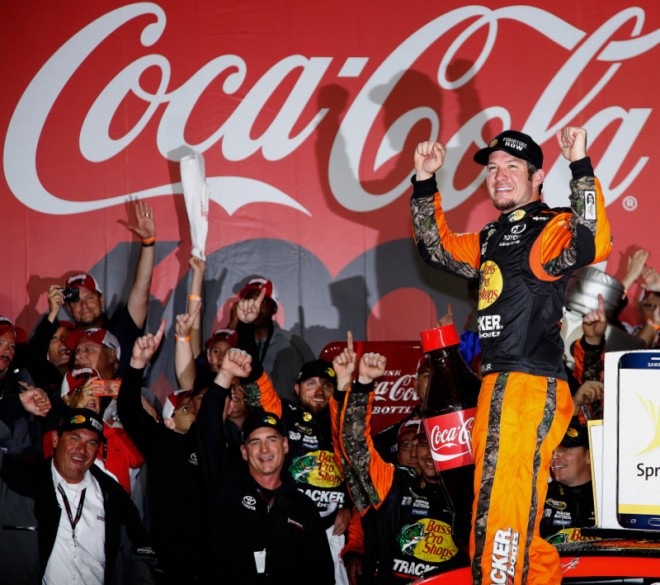 CHARLOTTE, NC - MAY 29: Martin Truex Jr., driver of the #78 Bass Pro Shops/Tracker Toyota, celebrates in Victory Lane after winning the NASCAR Sprint Cup Series Coca-Cola 600 at Charlotte Motor Speedway on May 29, 2016 in Charlotte, North Carolina. (Photo by Todd Warshaw/NASCAR via Getty Images)