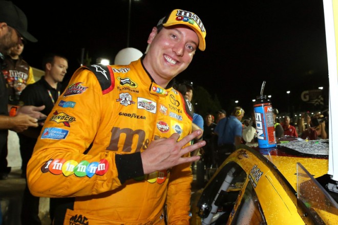 KANSAS CITY, KS - MAY 07: Kyle Busch, driver of the #18 M&M's Red Nose Toyota, celebrates after winning the NASCAR Sprint Cup Series Go Bowling 400 at Kansas Speedway on May 7, 2016 in Kansas City, Kansas. (Photo by Sean Gardner/NASCAR via Getty Images)