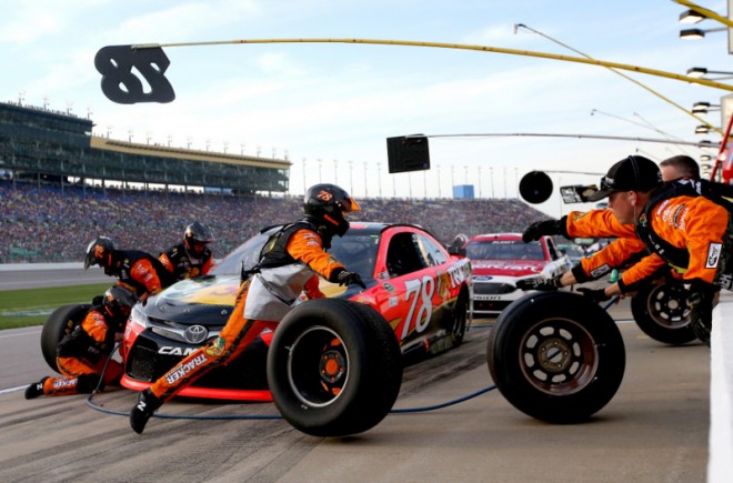 KANSAS CITY, KS - MAY 07: Martin Truex Jr., driver of the #78 Bass Pro Shops/TRACKER Boats Toyota Toyota, comes in for a pit stop during the NASCAR Sprint Cup Series Go Bowling 400 at Kansas Speedway on May 7, 2016 in Kansas City, Kansas. (Photo by Sean Gardner/NASCAR via Getty Images)