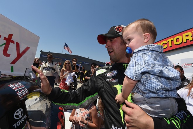 NEWTON, IA - JUNE 19: Sam Hornish Jr., driver of the #18 Toyota Camry Toyota, applies the winner's decal in victory lane after winning the NASCAR XFINITY Series American Ethanol E15 250 Presented by Enogen at Iowa Speedway on June 19, 2016 in Newton, Iowa. (Photo by Rainier Ehrhardt/NASCAR via Getty Images)