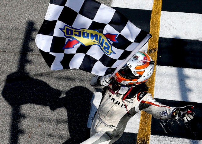 BROOKLYN, MI - JUNE 11:  Daniel Suarez, driver of the #19 ARRIS Toyota, celebrates with the checkered flag after winning the NASCAR XFINITY Series Menards 250 at Michigan International Speedway on June 11, 2016 in Brooklyn, Michigan.  (Photo by Sean Gardner/NASCAR via Getty Images)