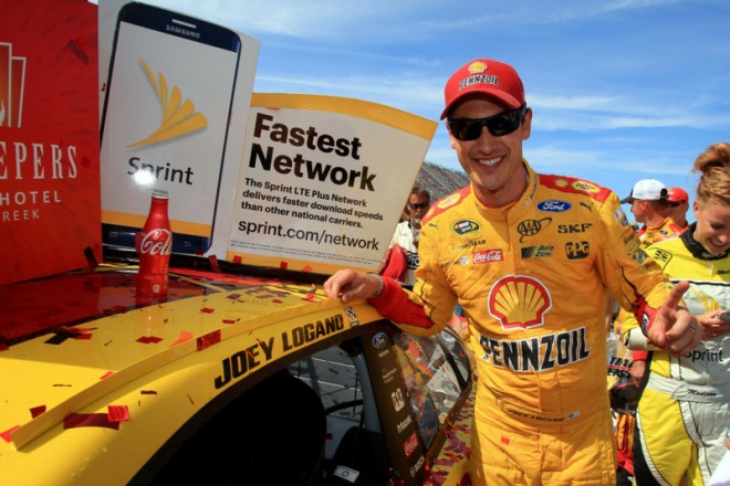 BROOKLYN, MI - JUNE 12:  Joey Logano, driver of the #22 Shell Pennzoil Ford, applies the winner's decal to his car in victory lane after winning the NASCAR Sprint Cup Series FireKeepers Casino 400 at Michigan International Speedway on June 12, 2016 in Brooklyn, Michigan.  (Photo by Daniel Shirey/NASCAR via Getty Images)