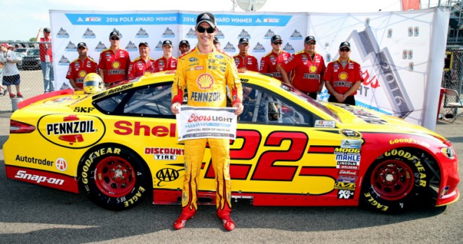 BROOKLYN, MI - JUNE 10:  Joey Logano, driver of the #22 Shell Pennzoil Ford, poses with the Coors Light Pole Award after qualifying for the NASCAR Sprint Cup Series FireKeepers Casino 400 at Michigan International Speedway on June 11, 2016 in Brooklyn, Michigan.  (Photo by Sean Gardner/NASCAR via Getty Images)