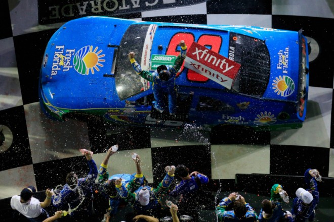DAYTONA BEACH, FL - JULY 01: Aric Almirola, driver of the #98 Fresh From Florida Ford, celebrates with champagne in Victory Lane after winning the NASCAR XFINITY Series Subway Firecracker 250 at Daytona International Speedway on July 1, 2016 in Daytona Beach, Florida. (Photo by Chris Trotman/Getty Images)