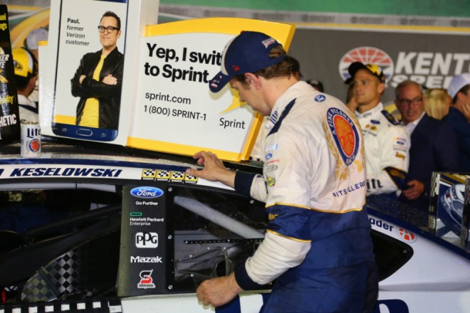 SPARTA, KY - JULY 09:  Brad Keselowski, driver of the #2 Miller Lite Ford, places the winner's decal on his car after winning the NASCAR Sprint Cup Series Quaker State 400 at Kentucky Speedway on July 9, 2016 in Sparta, Kentucky.  (Photo by Matt Sullivan/Getty Images)