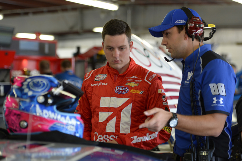 LOUDON, NH - JULY 15:  Alex Bowman, driver of the #88 Nationwide Chevrolet, stands in the garage area during practice for the NASCAR Sprint Cup Series New Hampshire 301 at New Hampshire Motor Speedway on July 16, 2016 in Loudon, New Hampshire. Bowman is pictured in his XFINITY Series fire suit.  (Photo by Robert Laberge/Getty Images)