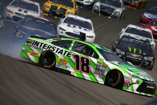 BROOKLYN, MI - AUGUST 28:  Kyle Busch, driver of the #18 Interstate Batteries Toyota, spins during an on track incident during the NASCAR Sprint Cup Series Pure Michigan 400 at Michigan International Speedway on August 28, 2016 in Brooklyn, Michigan.  (Photo by Sean Gardner/Getty Images)