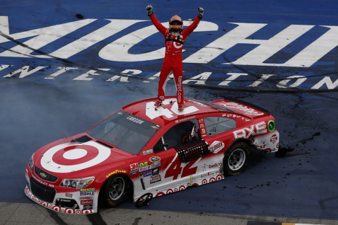 BROOKLYN, MI - AUGUST 28:  Kyle Larson, driver of the #42 Target Chevrolet, celebrates after winning the NASCAR Sprint Cup Series Pure Michigan 400 at Michigan International Speedway on August 28, 2016 in Brooklyn, Michigan.  (Photo by Jeff Zelevansky/NASCAR via Getty Images)