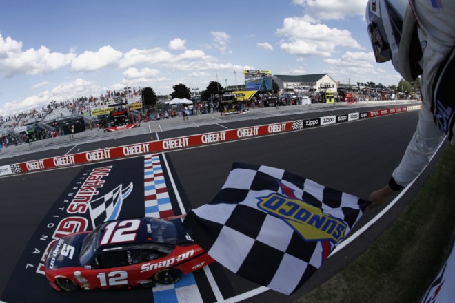 WATKINS GLEN, NY - AUGUST 06: Joey Logano, driver of the #12 Snap-On Ford, takes the checkered flag to win the NASCAR XFINITY Series Zippo 200 at Watkins Glen International on August 6, 2016 in Watkins Glen, New York. (Photo by Jeff Zelevansky/NASCAR via Getty Images)