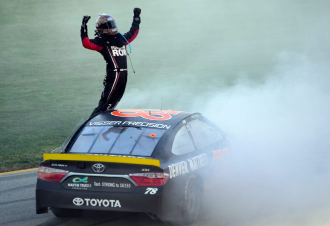 JOLIET, IL - SEPTEMBER 18:  Martin Truex Jr, driver of the #78 Furniture Row/Denver Mattress Toyota, celebrates after winning the NASCAR Sprint Cup Series Teenage Mutant Ninja Turtles 400 at Chicagoland Speedway on September 18, 2016 in Joliet, Illinois.  (Photo by Robert Laberge/Getty Images)