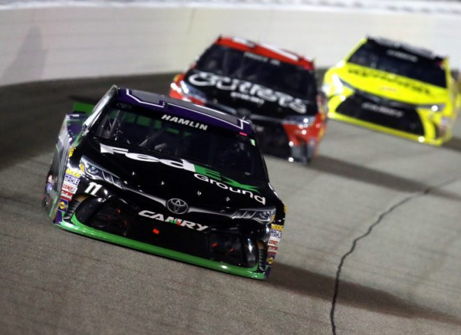 RICHMOND, VA - SEPTEMBER 10:  Denny Hamlin, driver of the #11 FedEx Ground Toyota, leads a pack of cars during the NASCAR Sprint Cup Series Federated Auto Parts 400 at Richmond International Raceway on September 10, 2016 in Richmond, Virginia.  (Photo by Chris Graythen/NASCAR via Getty Images)