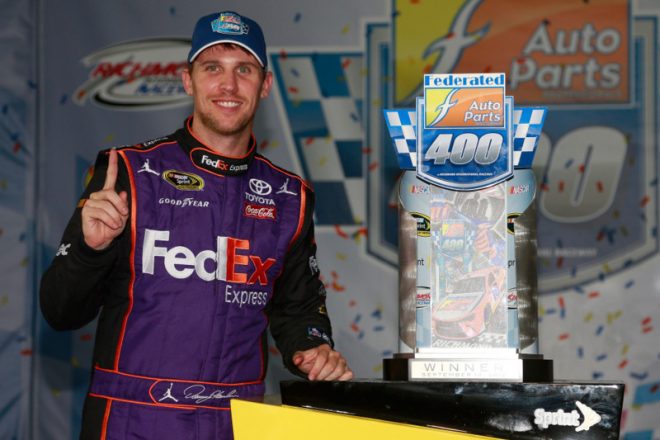 RICHMOND, VA - SEPTEMBER 10:  Denny Hamlin, driver of the #11 FedEx Ground Toyota, poses with the trophy in Victory Lane after winning the NASCAR Sprint Cup Series Federated Auto Parts 400 at Richmond International Raceway on September 10, 2016 in Richmond, Virginia.  (Photo by Matt Sullivan/NASCAR via Getty Images)