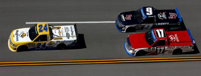 TALLADEGA, AL - OCTOBER 22:  Grant Enfinger, driver of the #24 Plugfones Chevrolet, leads William Byron, driver of the #9 Liberty University Toyota, and Timothy Peters, driver of the #17 Red Horse Racing Toyota, during the NASCAR Camping World Truck Series fred's 250 at Talladega Superspeedway on October 22, 2016 in Talladega, Alabama.  (Photo by Sean Gardner/Getty Images)