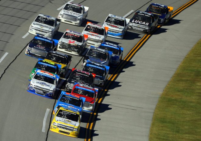 TALLADEGA, AL - OCTOBER 22:  Grant Enfinger, driver of the #24 Plugfones Chevrolet, leads the field during the NASCAR Camping World Truck Series fred's 250 at Talladega Superspeedway on October 22, 2016 in Talladega, Alabama.  (Photo by Patrick Smith/Getty Images)