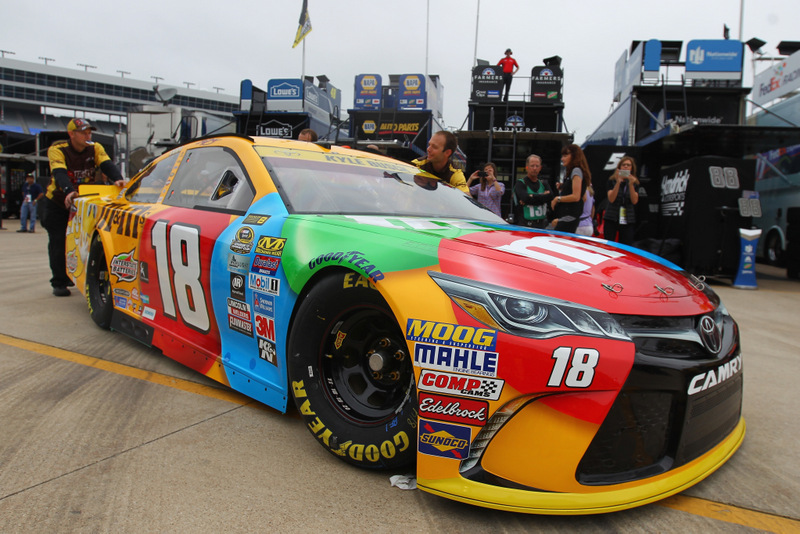 FORT WORTH, TX - NOVEMBER 04: Crew members push the car of Kyle Busch, driver of the #18 M&M's Toyota, in the garage area during practice for the NASCAR Sprint Cup Series AAA Texas 500 at Texas Motor Speedway on November 4, 2016 in Fort Worth, Texas. (Photo by Sarah Crabill/Getty Images)