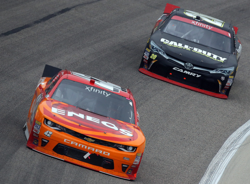 FORT WORTH, TX - NOVEMBER 05: Kyle Larson, driver of the #42 ENEOS Chevrolet, leads Erik Jones, driver of the #20 GameStop/Call of Duty Toyota, during the NASCAR XFINITY Series O'Reilly Auto Parts Challenge at Texas Motor Speedway on November 5, 2016 in Fort Worth, Texas. (Photo by Sean Gardner/NASCAR via Getty Images)