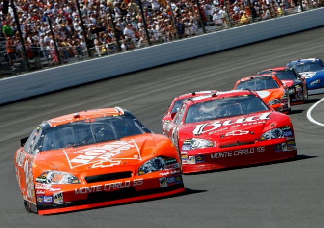 INDIANAPOLIS - JULY 29:  Tony Stewart, driver of the #20 Home Depot Chevrolet, races Dale Earnhardt Jr., driver of the #8 Budweiser Chevrolet, during the NASCAR Nextel Cup Series 14th Allstate 400 at the Brickyard at Indianapolis Motor Speedway on July 29, 2007 in Indianapolis, Indiana.  (Photo by Kevin C. Cox/Getty Images) *** Local Caption *** Tony Stewart;Dale Earnhardt Jr.